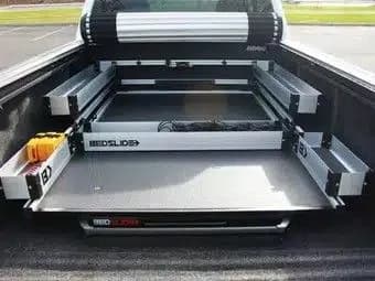 Truck bed cargo slide extended out over the open tailgate
