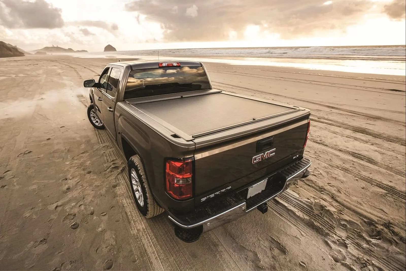 GMC Sierra with a retractable tonneau cover closed over the bed
