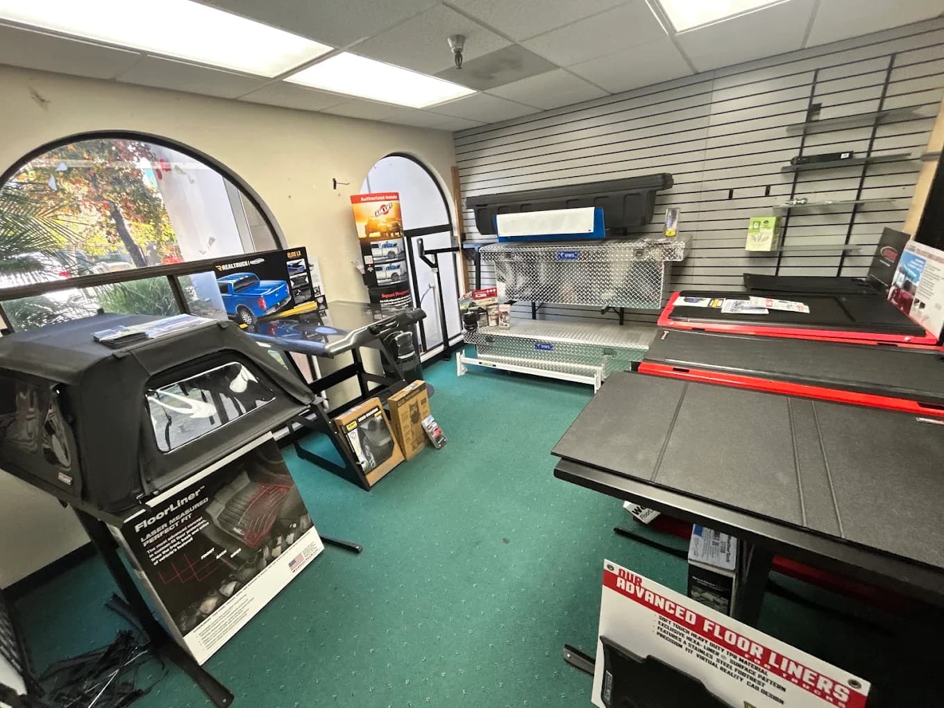 UWS aluminium crossover toolboxes and a WeatherTech FloorLiner display in the showroom